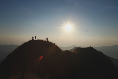 Scenic view of silhouette mountains against sky during sunset