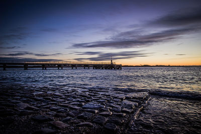 Scenic view of sea at sunset