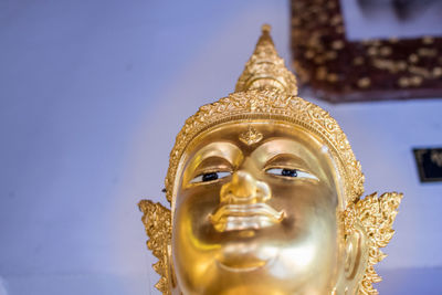 Statue of buddha against building