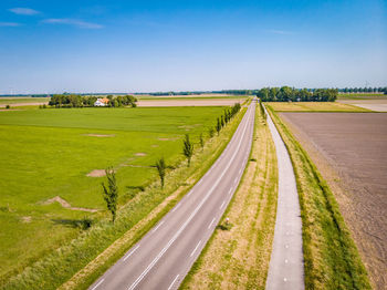 Scenic view of agricultural field against sky,