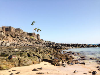 Scenic view of sea against blue sky