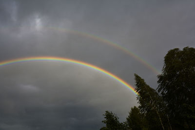 Low angle view of rainbow against sky