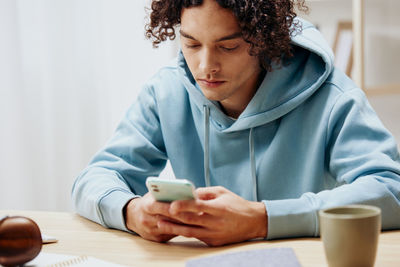 Young woman using mobile phone