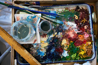 Close-up of paint in tray on table