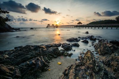 Scenic view of sea against sky at sunset