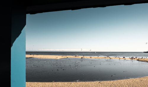 Scenic view of beach against clear sky