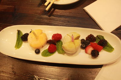 Close-up of served fruits in plate