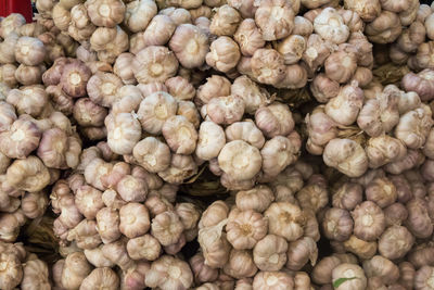 Full frame shot of garlic for sale at market stall