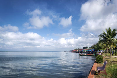 Scenic view of swimming pool by sea against sky