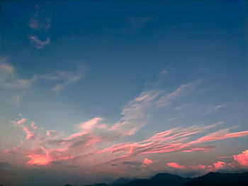 Low angle view of dramatic sky during sunset