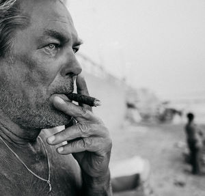 Portrait of man smoking cigarette