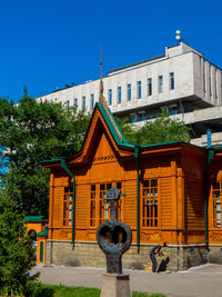 Sculpture of building against clear blue sky