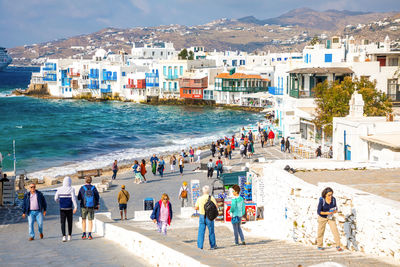 People at beach in city