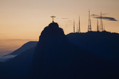 Christ the redeemer statue on mountain during sunset