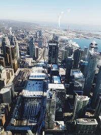 High angle view of modern buildings in city against sky
