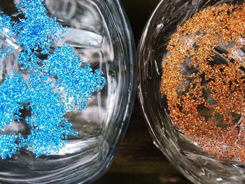 Directly above shot of glitters in glasses on table