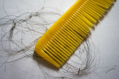 High angle view of yellow juice on table