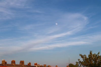 Low angle view of buildings against blue sky