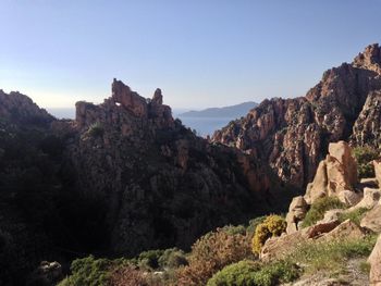 Rock formations on mountain against sky