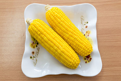 High angle view of vegetables in plate on table