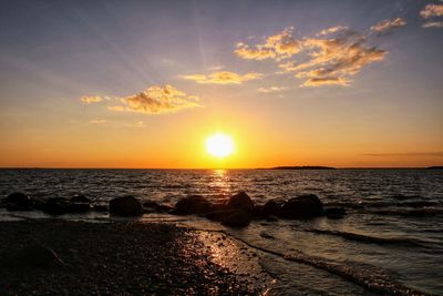 Scenic view of sea against sky during sunset