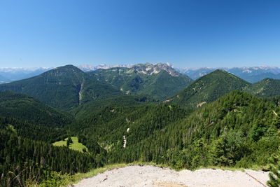 Scenic view of mountains against clear blue sky