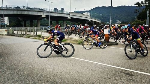 Man riding bicycle on road