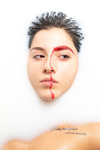 Portrait of a beautiful young woman over white background