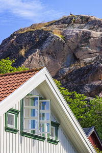 Cottage with open windows for ventilation