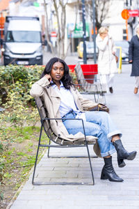 Portrait of woman sitting on chair