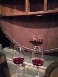 Close-up of wine glasses on table
