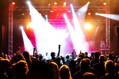 Crowd of people dancing in a concert
