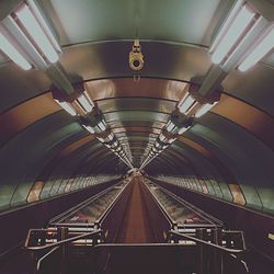 Low angle view of illuminated escalator