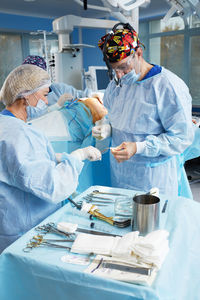 Dentist examining patient in hospital