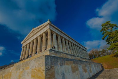 Low angle view of historical building against cloudy sky