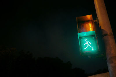 Low angle view of illuminated lights at night
