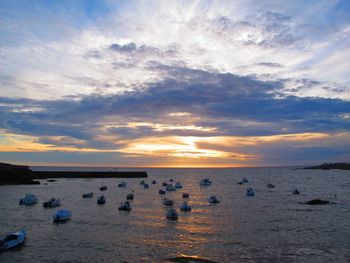 Scenic view of sea against sky at sunset