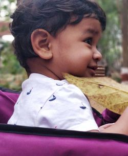 Close-up portrait of boy looking away