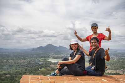 Three friends on top of the rock fortress of sigiriya