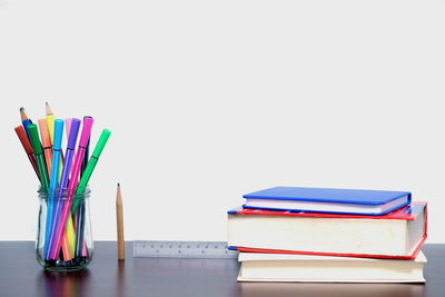 Close-up of multi colored pencils on table