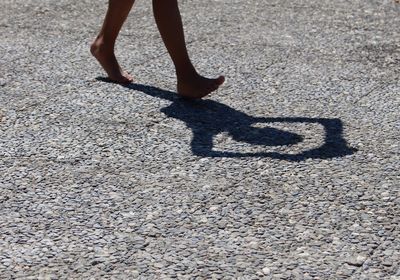 Low section of woman on road