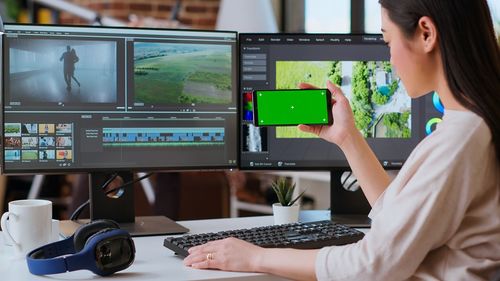 Side view of woman using mobile phone