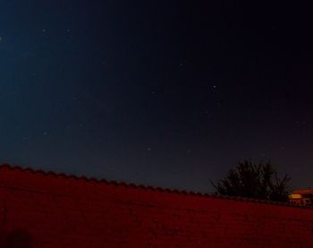 Low angle view of built structure at night