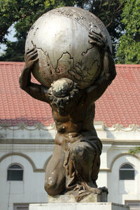 Close-up of statue against building