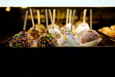 Close-up of sweet food in tray on table