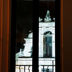 Exterior of historic building seen through glass window