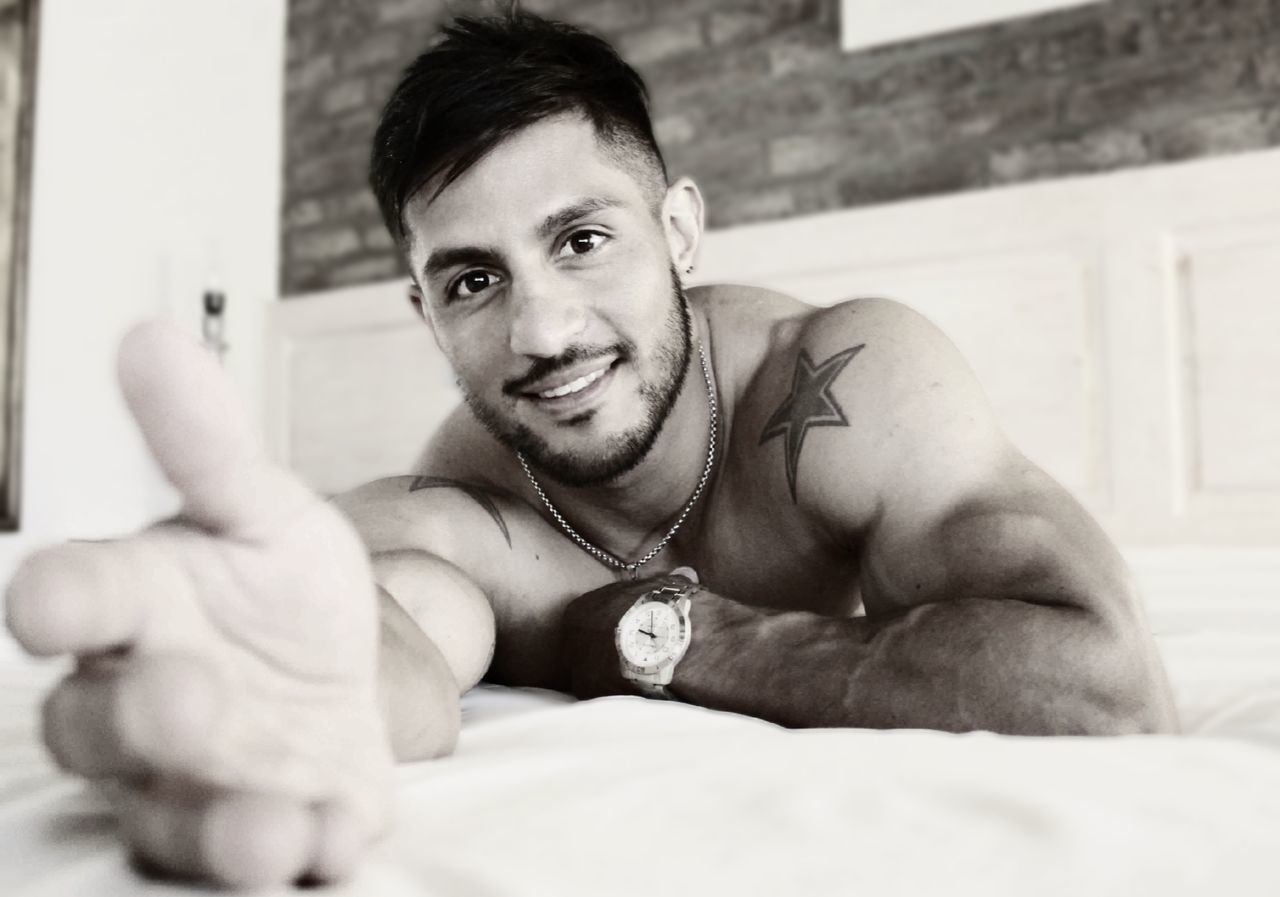 men, one person, adult, portrait, white, looking at camera, lifestyles, muscular build, smiling, black, person, black and white, young adult, emotion, happiness, beard, indoors, hand, portrait photography, arm, relaxation, sports, monochrome photography, facial hair, photo shoot, sitting, strength, human face, front view, athlete, cheerful, limb, monochrome, waist up, leisure activity, headshot, exercising