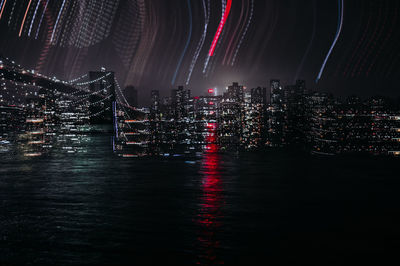 Digital composite image of illuminated buildings in city at night