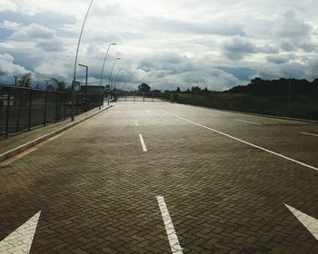 Empty road against sky