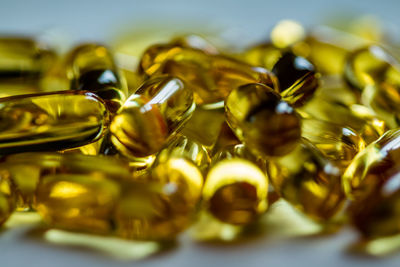Close-up of cod liver oil capsules on table